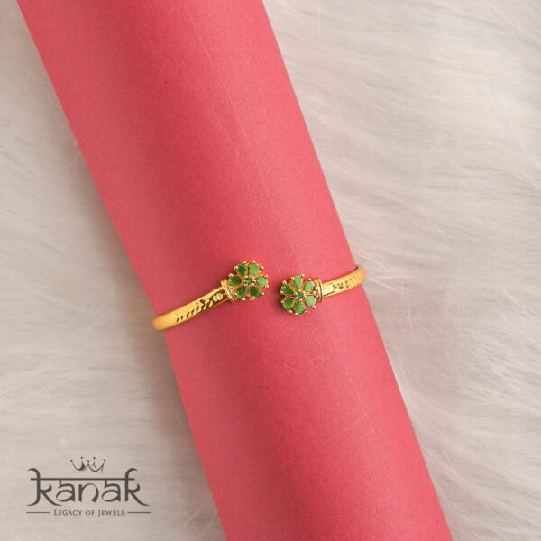 blossom beauty: 24k gold plated floral open cuff with green stone accents